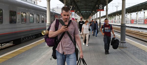 Пассажиры на Белорусском вокзале в Москве Пассажиры на Белорусском вокзале в Москве - Sputnik Беларусь