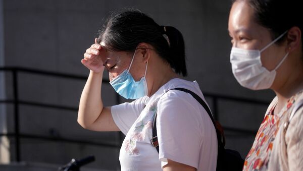 Женщины в медицинских масках в Китае - Sputnik Беларусь