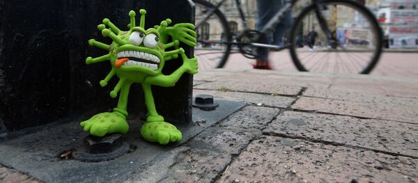 Пластиковая модель коронавируса на улице Боготы Пластиковая модель коронавируса на улице Боготы - Sputnik Беларусь