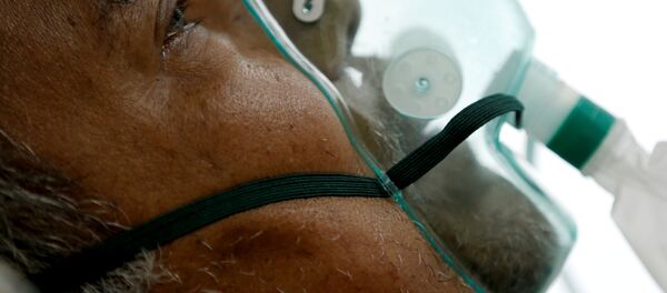 Больной коронавирусом в больнице в Индонезии - Sputnik Беларусь