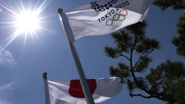 Флаги Японии и Олимпийских Игр в Токио - Sputnik Беларусь