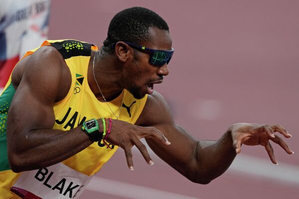 Йохан Блейк с Ямайки перед стартом в полуфинальном забеге на 100 метров - Sputnik Беларусь