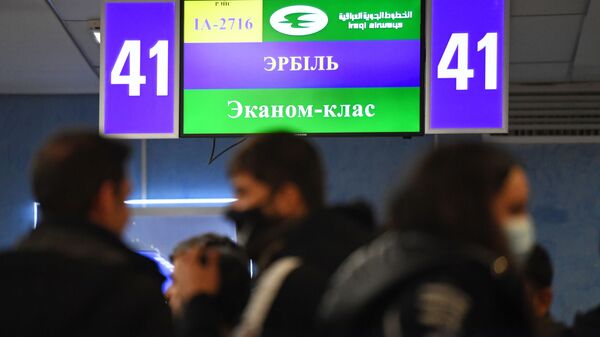 Беженцы в международном аэропорту Минска в ожидании вывозных рейсов авиакомпании Iraqi Airway - Sputnik Беларусь