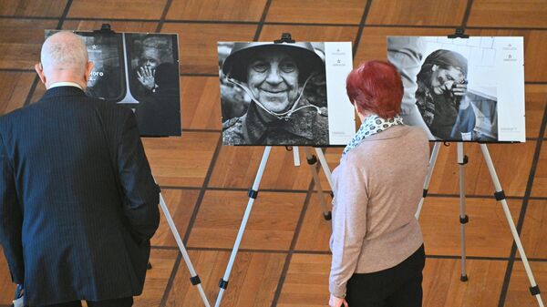 Фотовыставка о трагедии Донбасса открылась в Минске  - Sputnik Беларусь