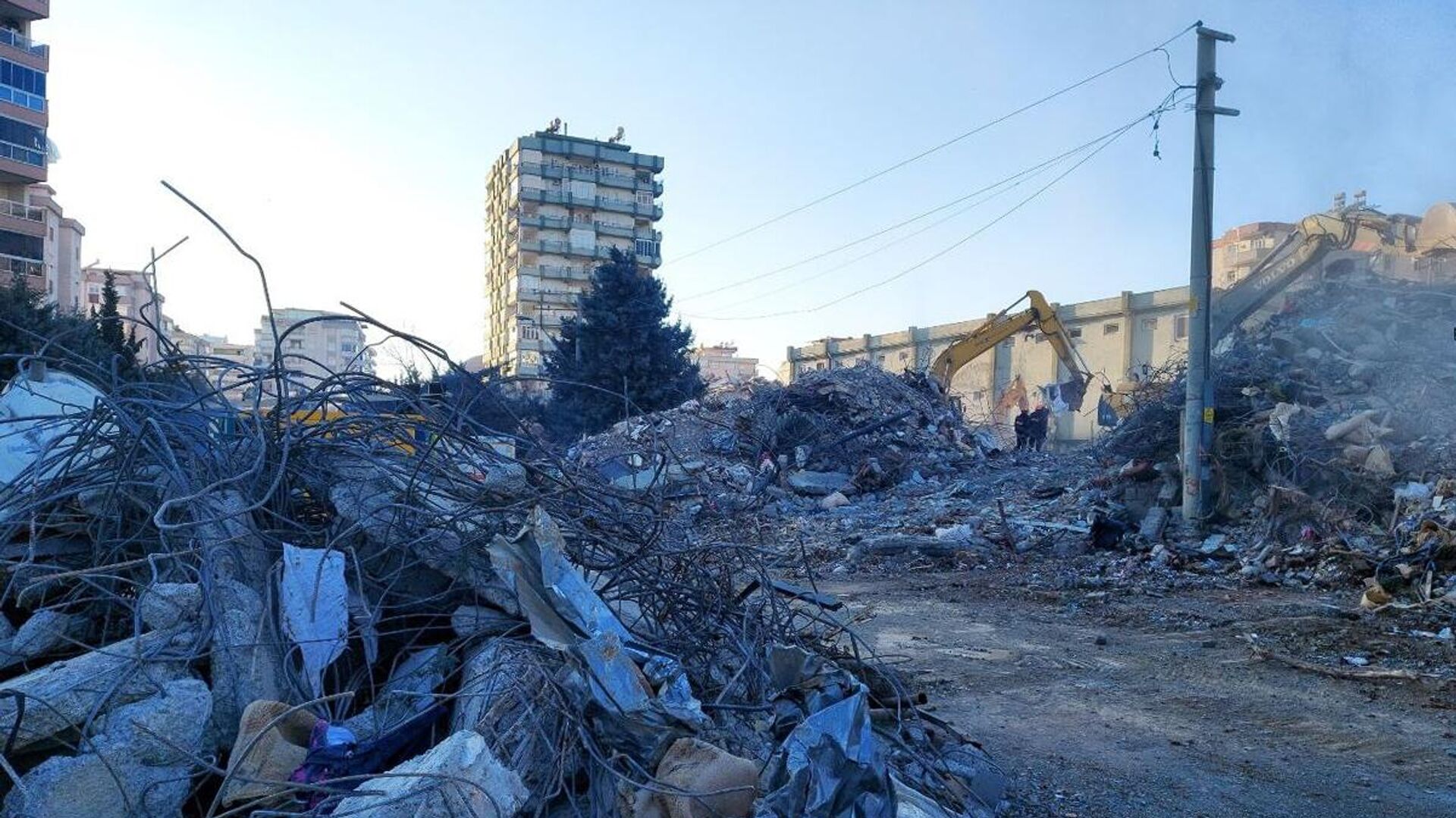Жилые дома, разрушенные в результате землетрясения в турецкой провинции Кахраманмараш - Sputnik Беларусь, 1920, 20.03.2023