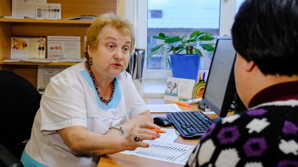 Женщина на приеме у врача, архивное фото - Sputnik Беларусь