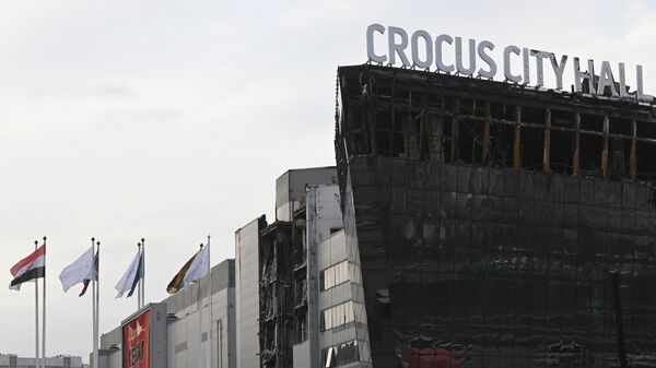 Здание концертного зала Крокус Сити Холл, где произошла стрельба и начался пожар - Sputnik Беларусь