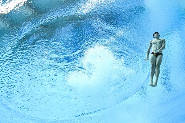 Сайрус Д Амико Монтес (Аргентина) в соревнованиях по прыжкам в воду с трамплина 3 метра среди мужчин. - Sputnik Беларусь