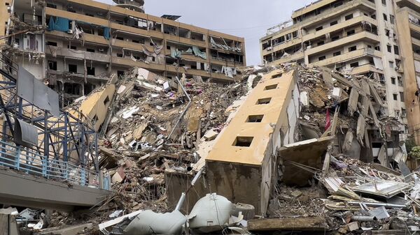 Разрушенные здания в центре Бейрута в результате атаки ВВС Израиля - Sputnik Беларусь