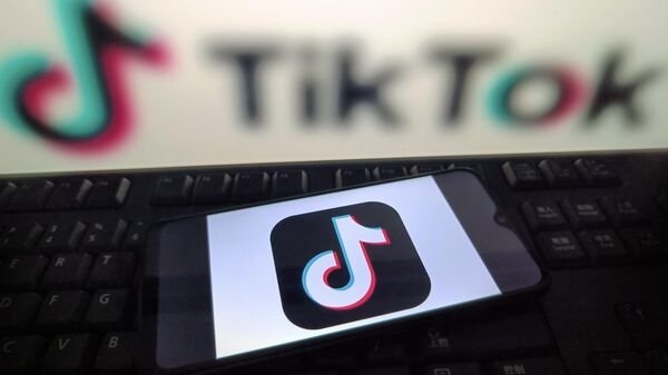 Логотип приложения TikTok  - Sputnik Беларусь