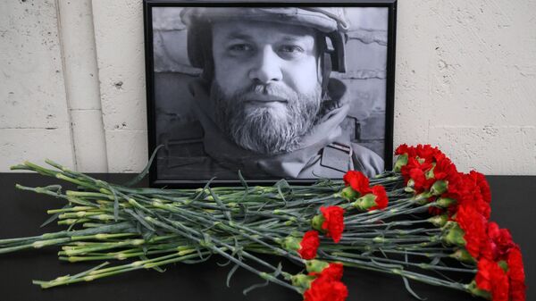 Фатаграфія ў памяць аб загінулым ваенным карэспандэнце РІА Навіны Іване Зуеве - Sputnik Беларусь