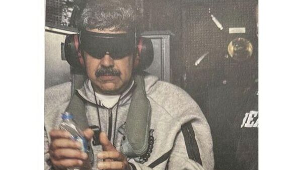 Трамп опубликовал первое фото Мадуро после захвата спецслужбами США - Sputnik Беларусь