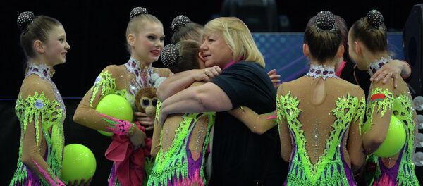 Главный тренер белорусской сборной Ирина Лепарская с юниорками Главный тренер белорусской сборной Ирина Лепарская с юниорками - Sputnik Беларусь