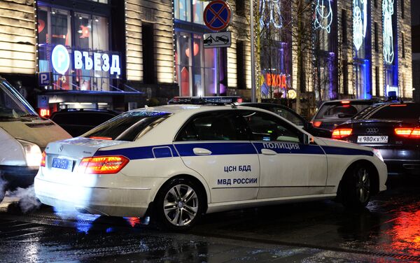 Полицейский автомобиль на улице в Москве - Sputnik Беларусь