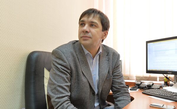 Автор и ведущий итоговых выпусков новостей 24 часа Игорь Позняк - Sputnik Беларусь