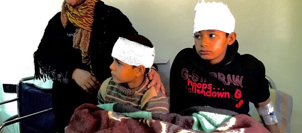 Сирийцы, пострадавшие в результате боевых действий - Sputnik Беларусь