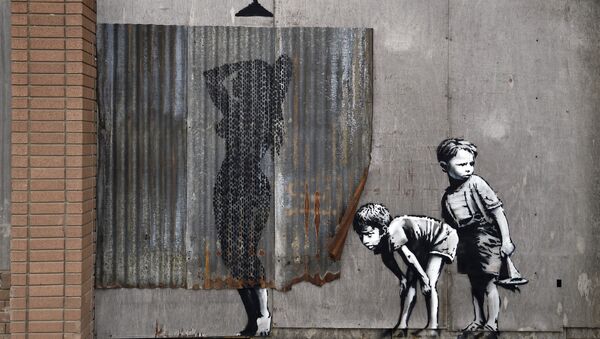 A mural is pictured at 'Dismaland', a theme park-styled art installation by British artist Banksy - Sputnik Беларусь