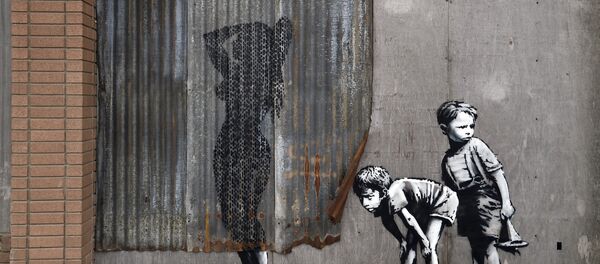 A mural is pictured at 'Dismaland', a theme park-styled art installation by British artist Banksy - Sputnik Беларусь