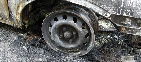 Сгоревший автомобиль. Архивное фото - Sputnik Беларусь