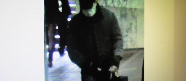 Фото предполагаемого грабителя на сайте ГУВД - Sputnik Беларусь