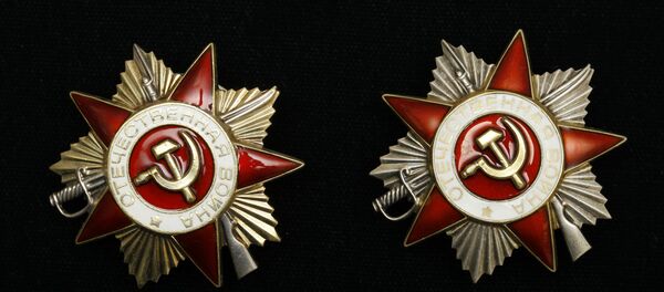 Орден Отечественной войны Первой и Второй степеней. Архивное фото Орден Отечественной войны Первой и Второй степеней. Архивное фото - Sputnik Беларусь