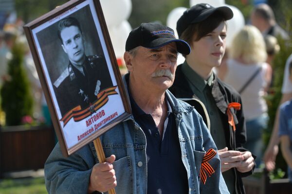 Минчане на акции памяти Беларусь помнит в столице. Минчане на акции памяти Беларусь помнит в столице. - Sputnik Беларусь