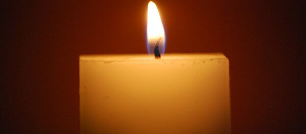 Горящая свеча. Архивное фото - Sputnik Беларусь