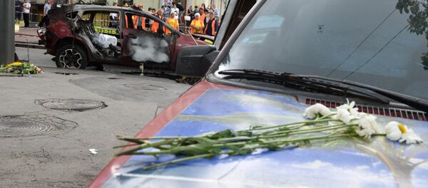 Взорванный автомобиль на перекрестке улиц Богдана Хмельницкого и Ивана Франко, в котором погиб журналист Павел Шеремет - Sputnik Беларусь