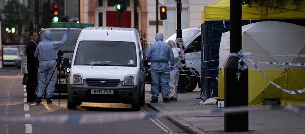 Police forensic officers work in Russell Square in London early on August 4, 2016, after a woman in her 60s was killed during a knife attack Police forensic officers work in Russell Square in London early on August 4, 2016, after a woman in her 60s was killed during a knife attack - Sputnik Беларусь