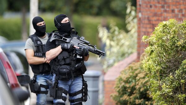 Members of French special police forces of Research and Intervention Brigade (BRI) are seen during a raid after a hostage-taking in the church in Saint-Etienne-du-Rouvray near Rouen in Normandy, France, July 26, 2016. - Sputnik Беларусь