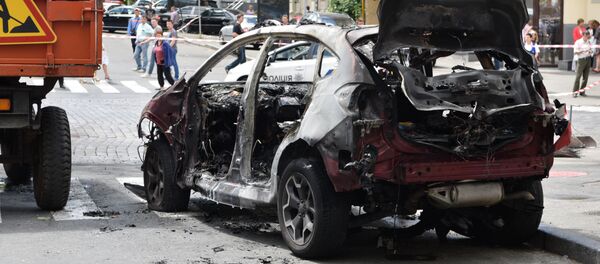 Взорванный автомобиль на перекрестке улиц Богдана Хмельницкого и Ивана Франко, в котором погиб журналист Павел Шеремет Взорванный автомобиль на перекрестке улиц Богдана Хмельницкого и Ивана Франко, в котором погиб журналист Павел Шеремет - Sputnik Беларусь