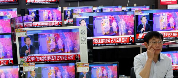 Сообщение о ядерных испытаниях по ТВ в Южной Корее Сообщение о ядерных испытаниях по ТВ в Южной Корее - Sputnik Беларусь