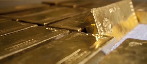 Золотые слитки в хранилище банка Золотые слитки в хранилище банка - Sputnik Беларусь