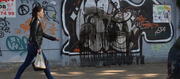 Вандалы повредили граффити на Октябрьской - Sputnik Беларусь