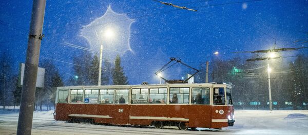 Трамвай в городе, архивное фото Трамвай в городе, архивное фото - Sputnik Беларусь