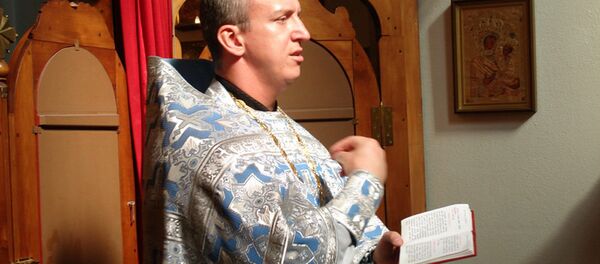 Константин Бурыкин в храме - Sputnik Беларусь