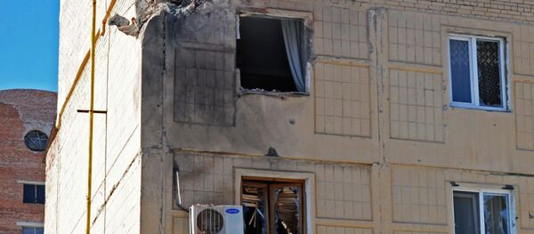 Жилое здание в Донецке, пострадавшее от обстрела Жилое здание в Донецке, пострадавшее от обстрела - Sputnik Беларусь