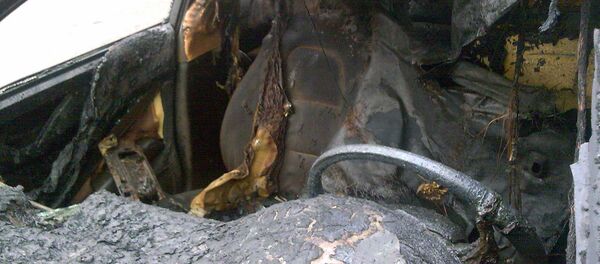 Сгоревший автомобиль, архивное фото Сгоревший автомобиль, архивное фото - Sputnik Беларусь