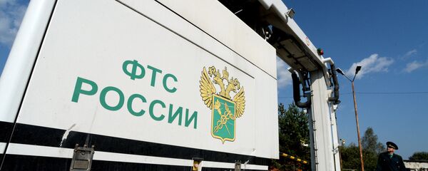 Оператор инспекционно-досмотрового комплекса на многостороннем автомобильном пункте пропуска Оператор инспекционно-досмотрового комплекса на многостороннем автомобильном пункте пропуска - Sputnik Беларусь