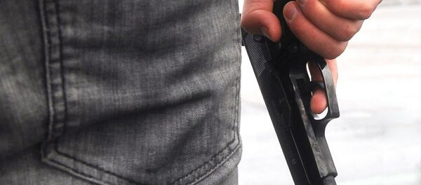 Человек с пистолетом, архивное фото - Sputnik Беларусь