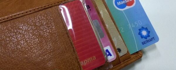 Кошелек с платежной картой Белкарт Кошелек с платежной картой Белкарт - Sputnik Беларусь