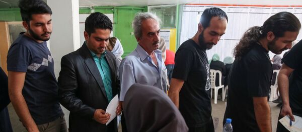 Иранцы голосуют на президентских выборах - Sputnik Беларусь