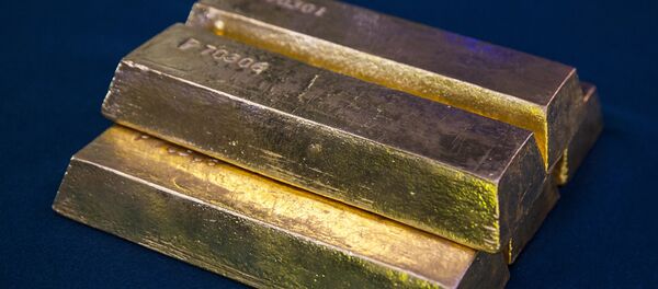 Золотые слитки, архивное фото Золотые слитки, архивное фото - Sputnik Беларусь