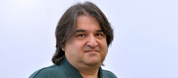 Опытный репетитор Евгений Ливянт, архивное фото - Sputnik Беларусь