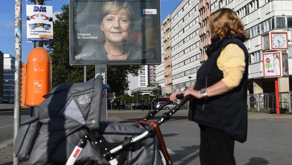 Плакат с изображением канцлера Германии, лидера Христианско-демократического союза Ангелы Меркель - Sputnik Беларусь