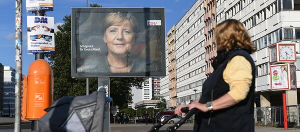 Плакат с изображением канцлера Германии, лидера Христианско-демократического союза Ангелы Меркель - Sputnik Беларусь