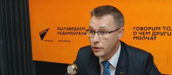 Политический обозреватель АТН Андрей Кривошеев Политический обозреватель АТН Андрей Кривошеев - Sputnik Беларусь