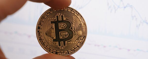 Криптовалюта биткоин, архивное фото Криптовалюта биткоин, архивное фото - Sputnik Беларусь