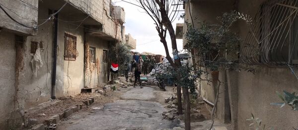 Лагерь беженцев Вафидин в районе гуманитарного коридора между Дамаском и Восточной Гутой в Сирии - Sputnik Беларусь