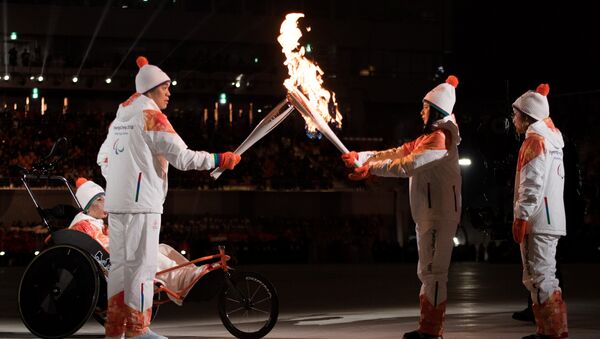 Огонь Паралимпиады зажгли в Пхенчхане - Sputnik Беларусь